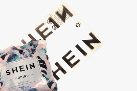 Krasnodar, Russia-December 7, 2020: parcel from the online store with Shein. Isolated on a white backgroundのeditorial素材