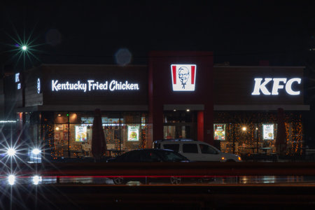 Fast food KFC at night. The sign and trading floor are lit up
