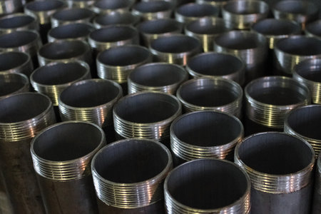 Steel pipes with threads in a production warehouse