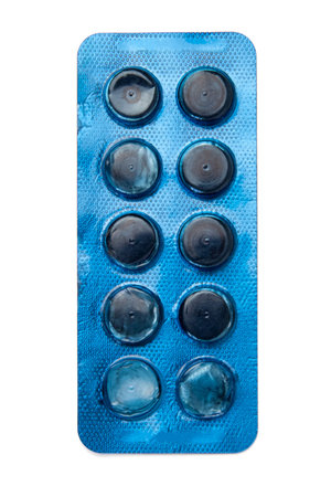 Tablets in a blue blister pack isolated on a white background. Close-up