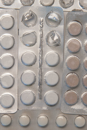 Silver blister packs with tablets Background image. Close-upの写真素材