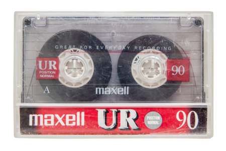 Krasnodar, Russia - March 11, 2021: An old worn Maxell audio cassette in a podcassette isolated on a...