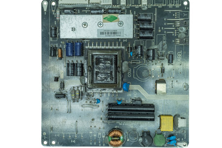 The power supply board with an inverter for an LCD TV is isolated on a white background. The...