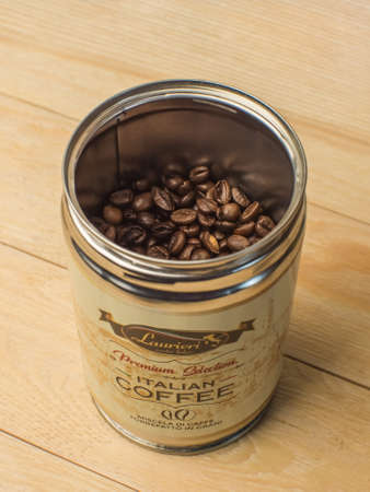 Krasnodar, Russia - April 7, 2021: An open can of Italian coffee beans Lauieri. Wooden fountainのeditorial素材