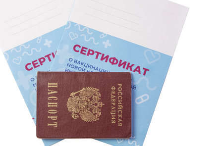 Close-up of the Russian passport and two certificates of vaccination. Translation: certificate of vaccination against a new coronavirus infection COVID-19のeditorial素材