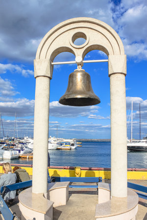 Odessa, Ukraine, October 9, 2012: The bell on the arch in the seaport of Odessa. The ship's bell was cast in 1932. It was found by sailors in 1975 on the bottom of the Atlantic Oceanのeditorial素材