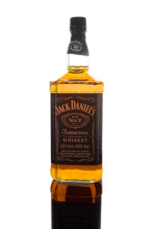 Jack Daniels Old No.7 whiskey bottle on white background with beautiful reflection. The oldest whiskey brand from the USA. Russia, Krasnodar, December 15, 2021のeditorial素材