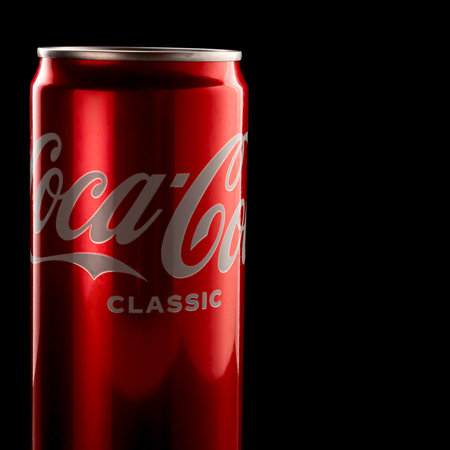 Small aluminum can of Coca-Cola insulated on black background. Coca-Cola Classic. Russia, Krasnodar, December 15, 2021のeditorial素材