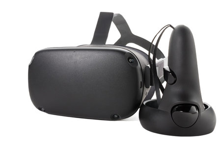Close-up of joystick and VR headset isolated on white background. Controller and VR glasses. front...