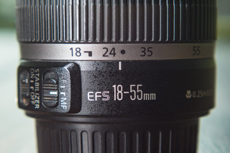 Side view of a DSLR lens. Close-up of the controls and zoom scale on the 18-55mm lensの写真素材