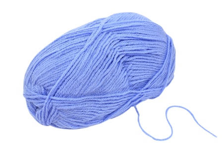 Close up of blue wool knitting on white backgroundの写真素材