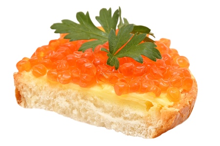 Sandwich with red caviar and parsley isolated on white backgroundの写真素材