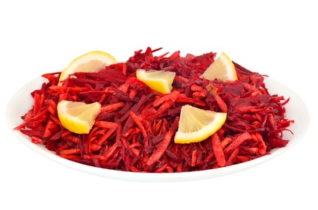 Grated beet raw beet on a plate isolated on white backgroundの写真素材