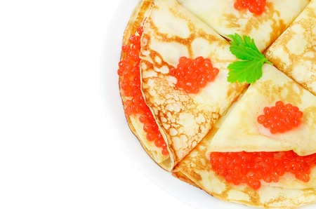 Pancakes with red caviar on a plate isolated on white backgroundの写真素材