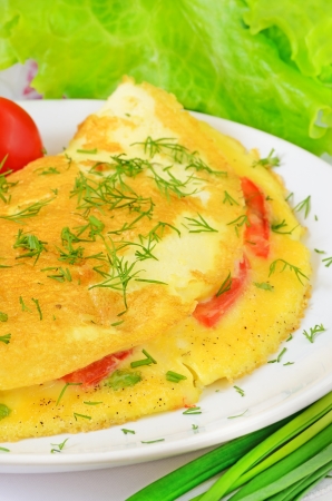 Omelet with herbs and vegetables on the plateの写真素材