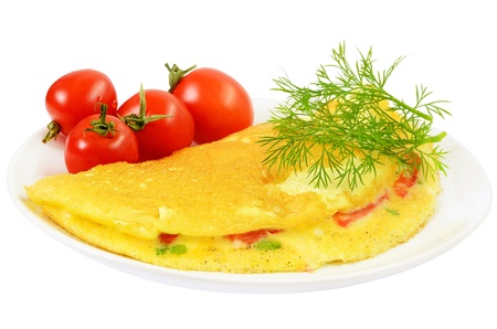 Omelet with herbs and vegetables on the plate isolated on white backgroundの写真素材