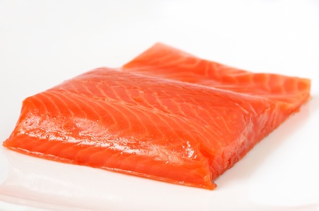 Salted salmon fillet on the white plateの写真素材