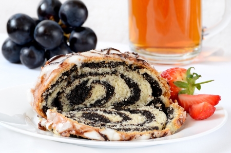 Cake with poppy seeds, fruits and tea の写真素材