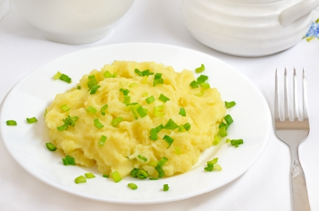 Mashed potatoes on a white plate on the tableの写真素材
