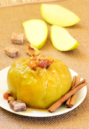 Baked apple with raisins and nuts の写真素材