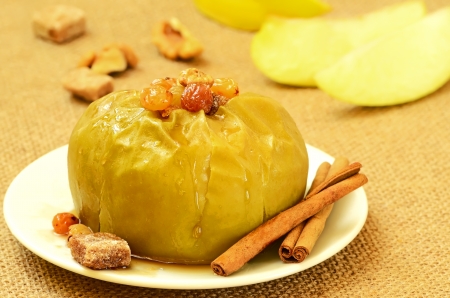 Baked apple with raisins and nuts の写真素材