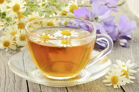 Cup of herbal tea with chamomile flowersの写真素材