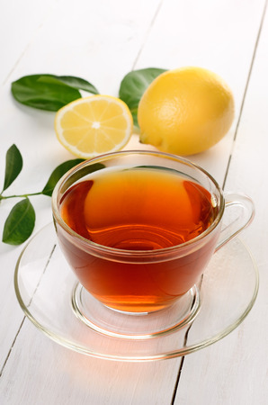 Tea with lemon on wooden tableの写真素材