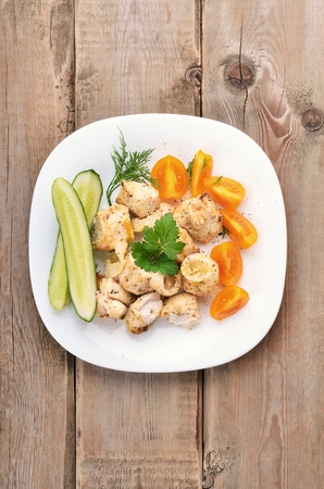 Chicken shish kebab on wooden table, top viewの写真素材