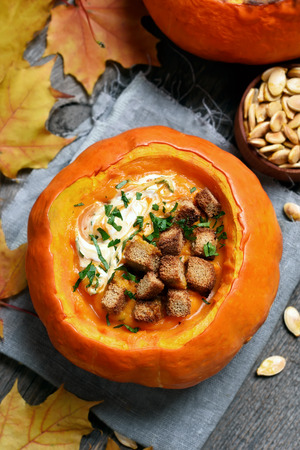 Cream soup in a pumpkin, top viewの写真素材