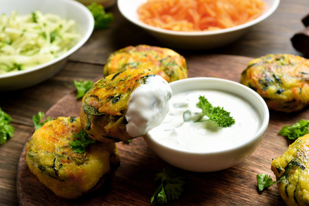 Vegetarian vegetable cutlet from carrot, zucchini, potato with sauce. Healthy diet food concept. Close up viewの写真素材