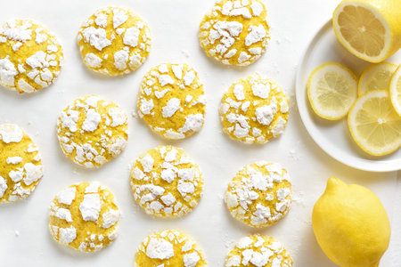 Healthy lemon crinkle cookies on baking paper. Top view, flat layの写真素材
