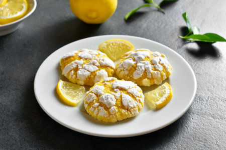 Lemon cookies on plate over dark stone background. Close up viewの写真素材