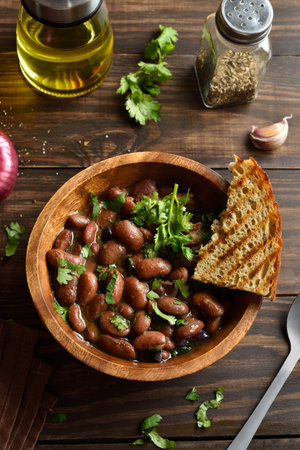 Baked beans in bowl on wooden table. Close up viewの写真素材