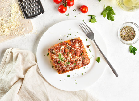 Lasagna with bolognese sauce and ricotta cheese on white background. Top view, flat layの写真素材