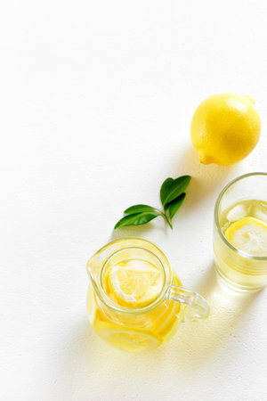Lemon lemonade on white background with copy space. Cold summer drinkの写真素材