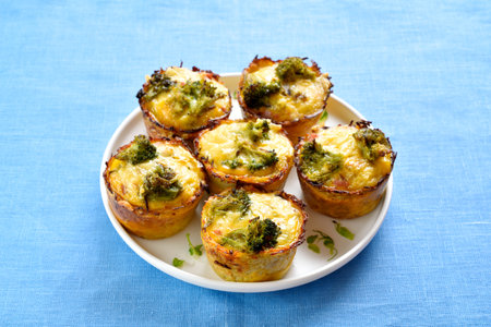 Healthy loaded egg muffins made with eggs, bacon, broccoli, cheese. Diet meal for breakfast or lunch. Close up viewの写真素材