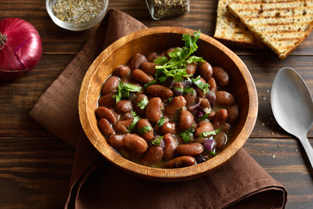 Baked red beans in bowl on wooden table. Close up viewの写真素材