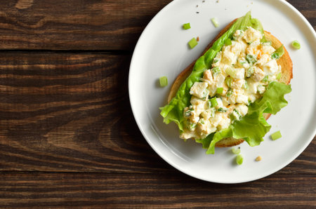 Close up view of egg salad sandwich on wooden background with free space. Top view, flat layの写真素材