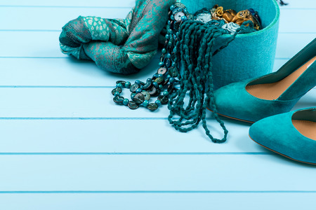 Set of fashionable women's acsessories on the blue wooden background.の写真素材