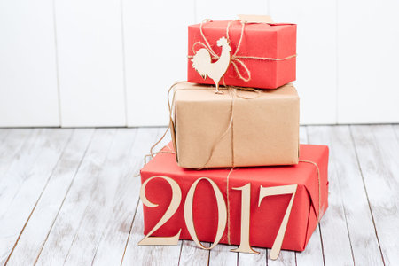 Christmas gift boxes over thr wooden background. Concept 2017 new year .