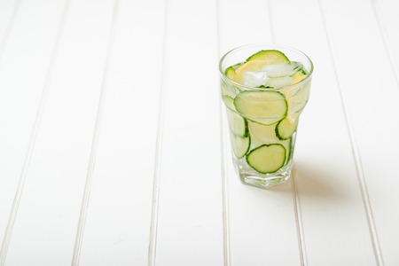 Water detox with cucumber and lemon. Space for text.の写真素材