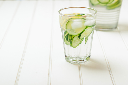Water detox with cucumber and lemon. Space for text.の写真素材