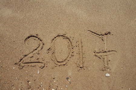 The Numbers 2017 on beach. New year holiday concept .の写真素材