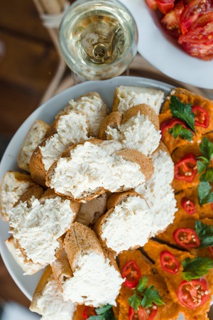 A lot of sandwiches with cheese dip, garlic and herbs, pumpkin caviar, bell pepper. Space for text.の写真素材