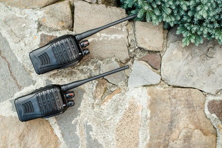 Walkie Talkies on the stones background outside. Concept of Wireless Communications.の写真素材