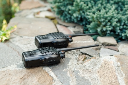 Walkie Talkies on the stones background outside. Concept of Wireless Communications.の写真素材