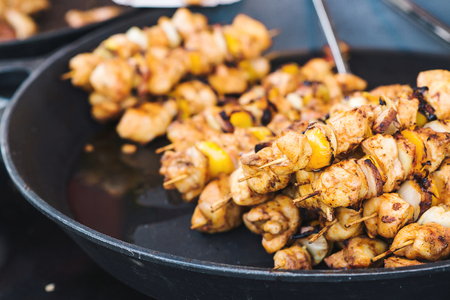 Roasted chicken kebab at the seasonal fair.の写真素材