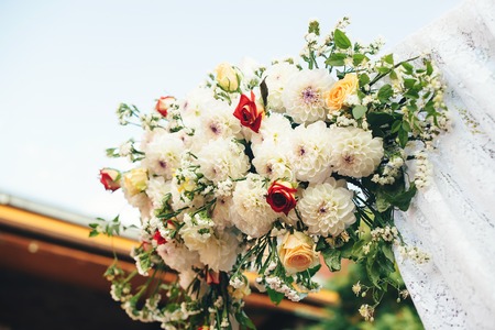 Flower decorations for the wedding ceremony outdoor. Beautiful bouquet of summer flowers.の写真素材