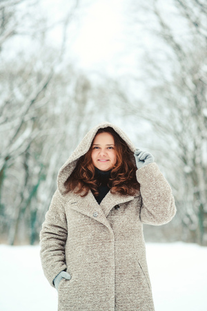 Happy young woman in a wintertime, walk in nature. Winter concept.の写真素材