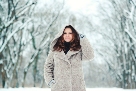 Happy young woman in a wintertime, walk in nature. Winter concept.の写真素材